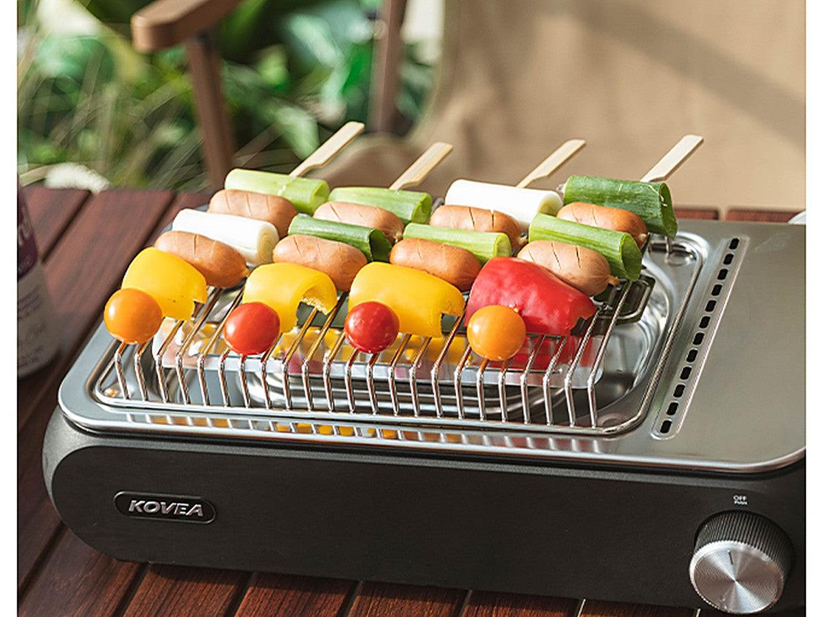 Guibada Ceramic Grill cooking colorful food skewers outdoors