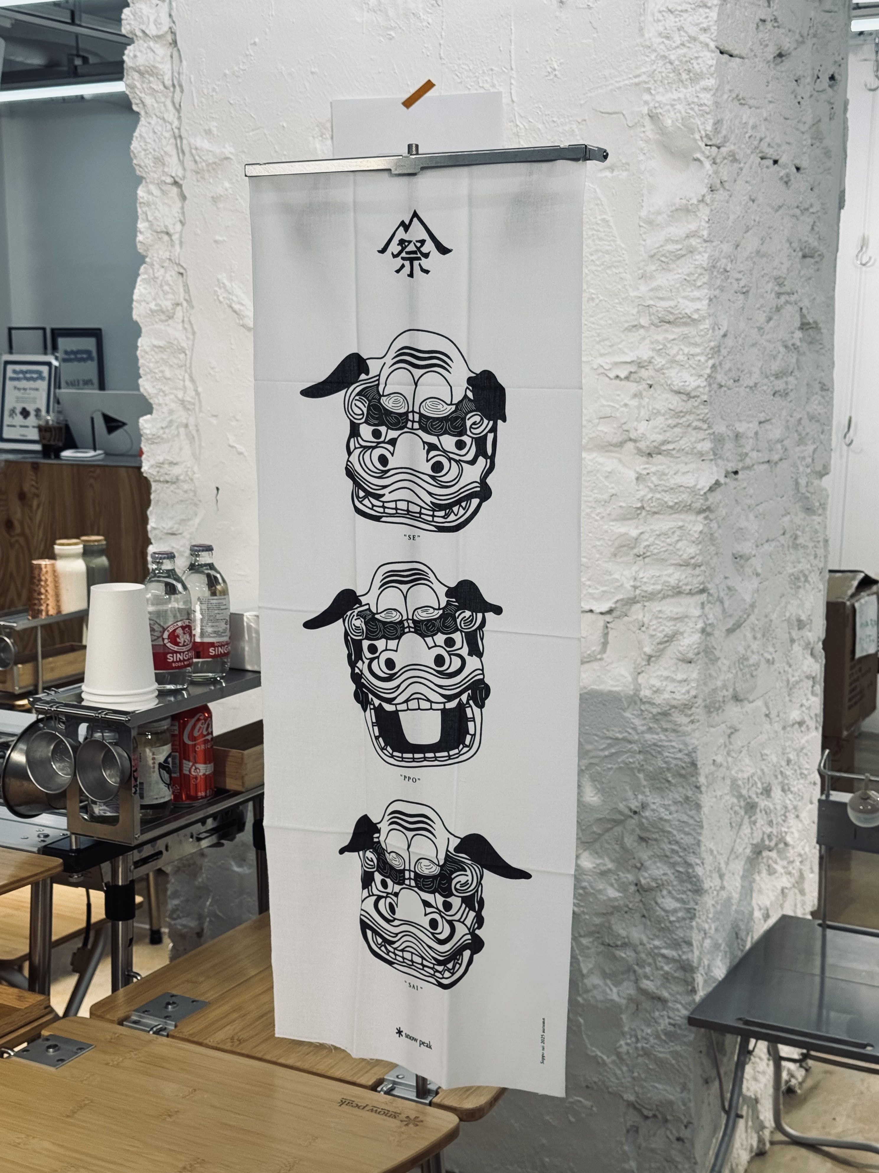 HR Tenugui Lantern Hanger displaying a tenugui in a store - Henrik Seo