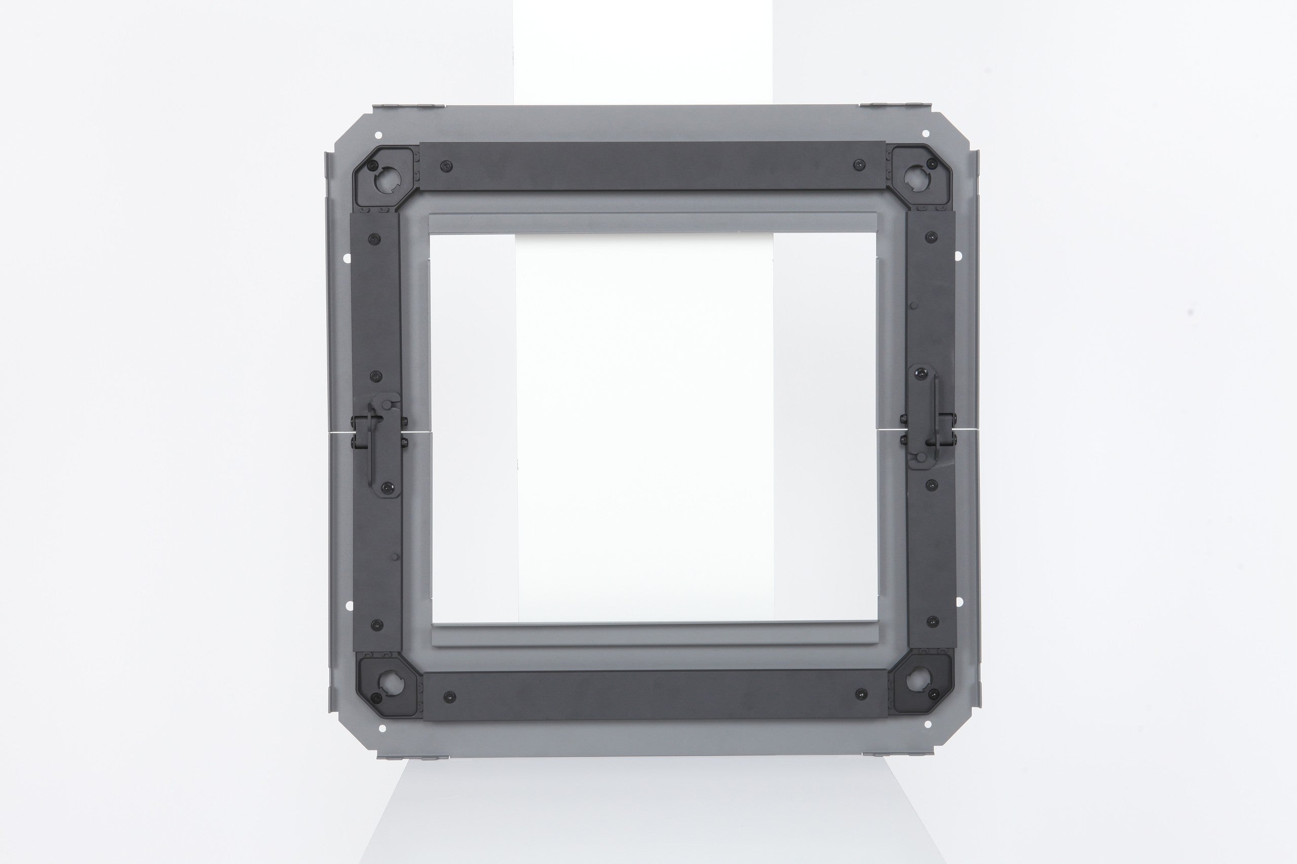Back view of the BUENOFE IGT Connect Table 1.5 on a white studio background, revealing the underside rail structure, folding hinge points and corner reinforcements that let the frame collapse flat.