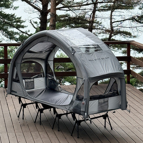 Neo Nest 80 Air with the included roof cover fitted, three-quarter view on a deck, side doors open (cot sold separately).