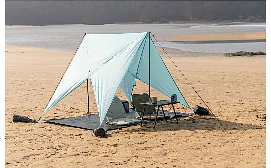Pop Hub set up as a sun shelter with chairs and a table