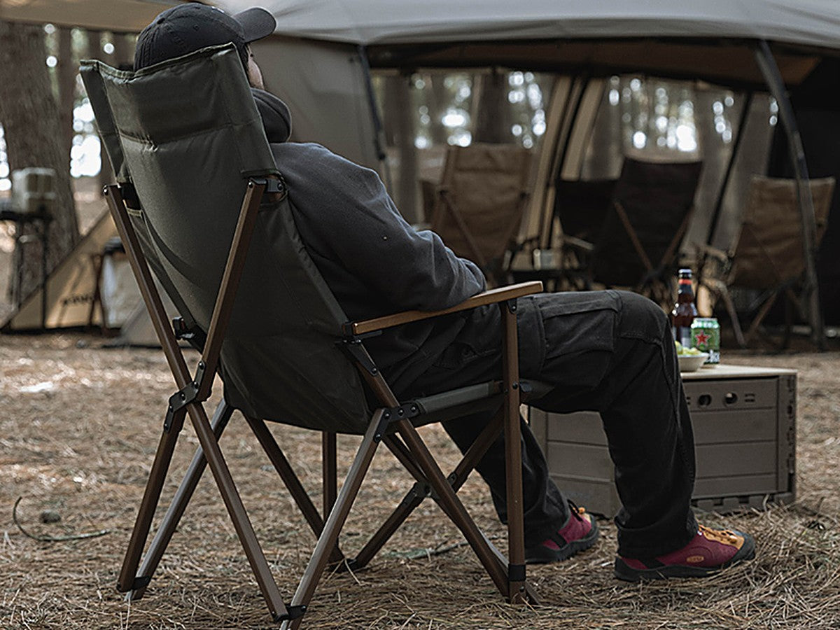 Person relaxing in the WS Relax Chair Plus at a campsite
