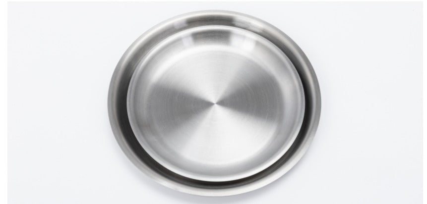 Stainless steel lid resting flat, showing how it doubles as a plate