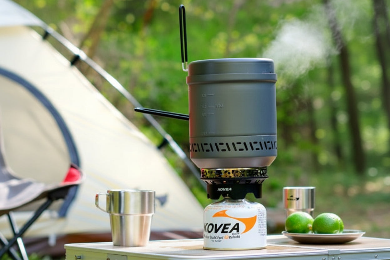 Alpine Master 3.8 boiling water on a camp table in the forest, steam rising
