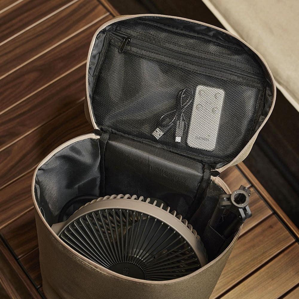 Zippered mesh pocket inside the lid of the V1040 size case holding a charging cable and remote