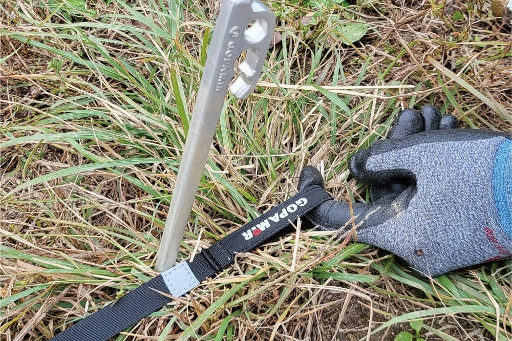 Reflective 3M stitch on webbing strap at exact stake-down position