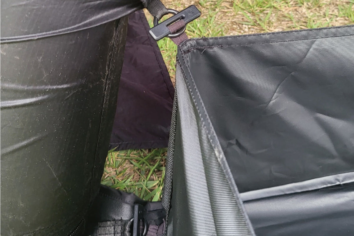 Square toggle hooked into air-beam attachment point on TN600 shelter