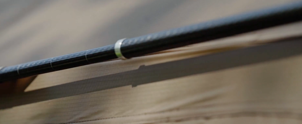 Gopamir G450 user tensioning guy line cord lock at Sand Brown canopy panel edge in daylight