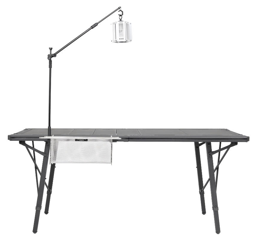 BUENOFE IGT Lantern Hanger shown front-on, mounted to a low aluminum camping table with the base pole upright and the boom arm extending out to hang a lantern above the tabletop, photographed on a clean white studio background.