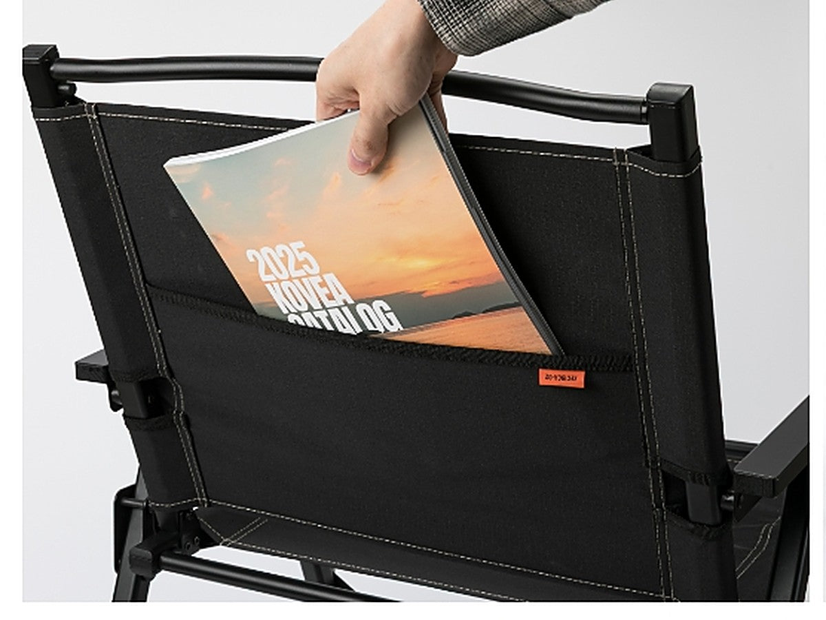 Hand sliding an item into the wide back pouch