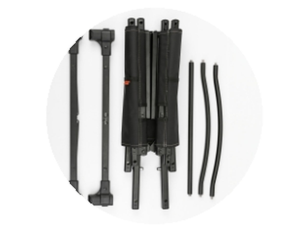 The chair frame fully separated into its parts: cross bars, folded frame bundle, and rods