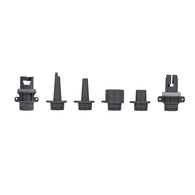 Six nozzle attachments laid out on a flat surface