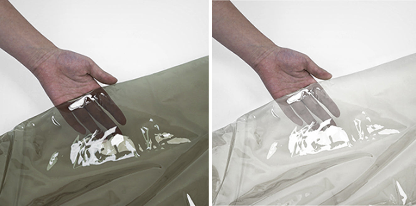 Hand holding smog TPU sample next to clear TPU sample for UV demonstration