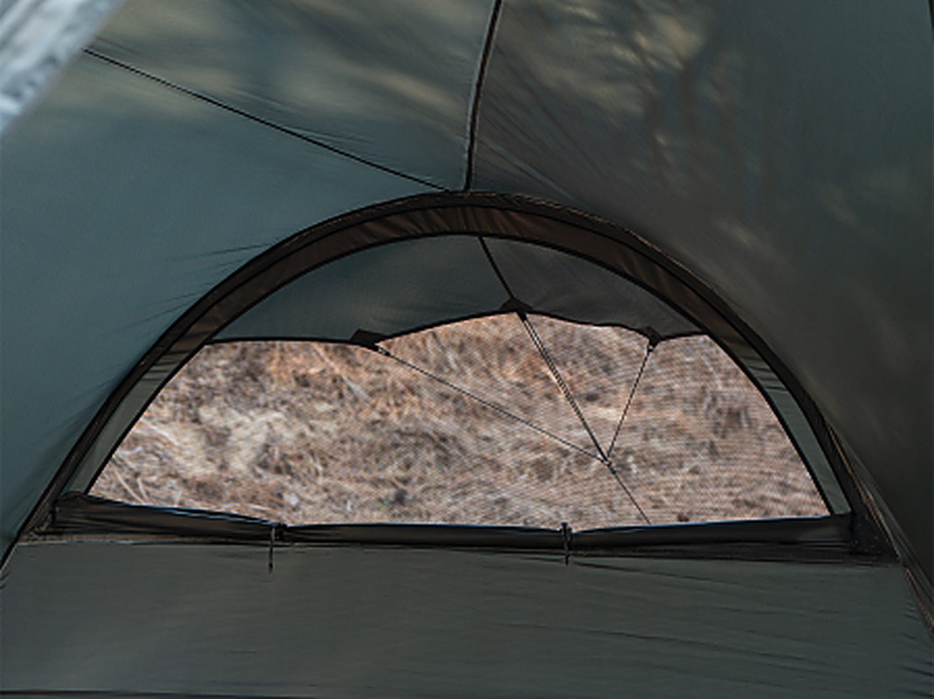 Interior view through the MGX-600 arched mesh door looking out to the landscape