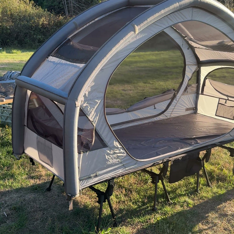 Neo Nest 80 Air on a camp cot in a field, both doors open (cot sold separately).