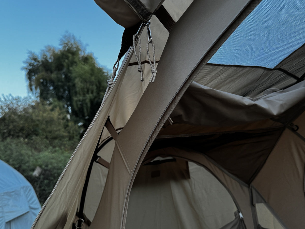 Rainfly door panel rolled back and toggled beside the tent door (tent and cot sold separately).