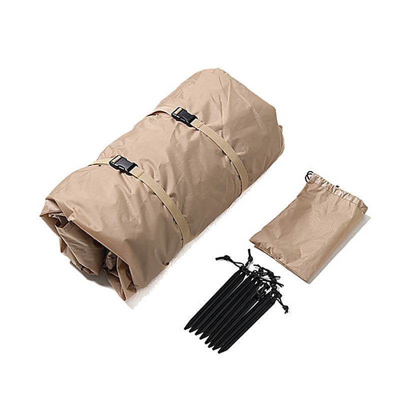 What is in the box: the rolled rainfly with straps, the peg pouch and the pegs laid out on white.