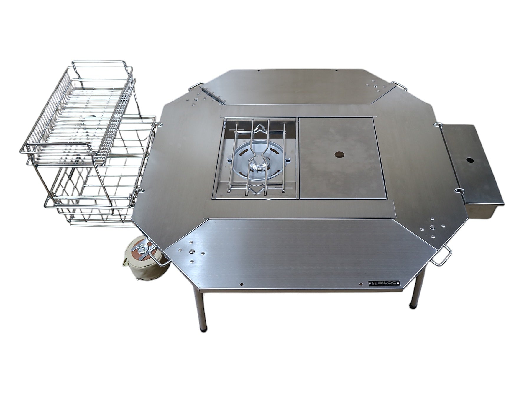 IGT side hanger with wire baskets mounted on one plate of the Octa table and a side tray on another, using the standardised connect holes.