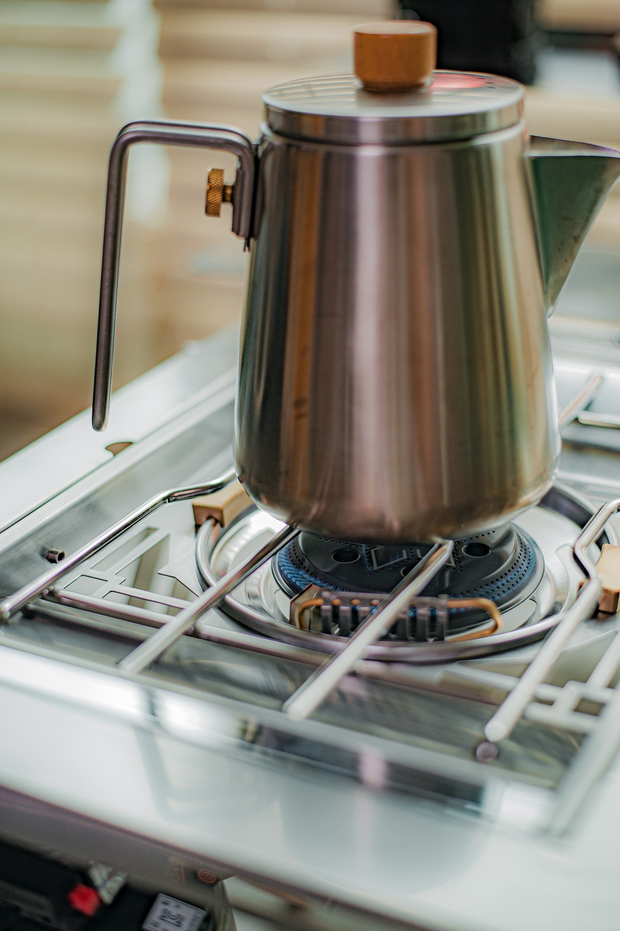 Kettle boiling on the Personal Flat Burner with a blue flame