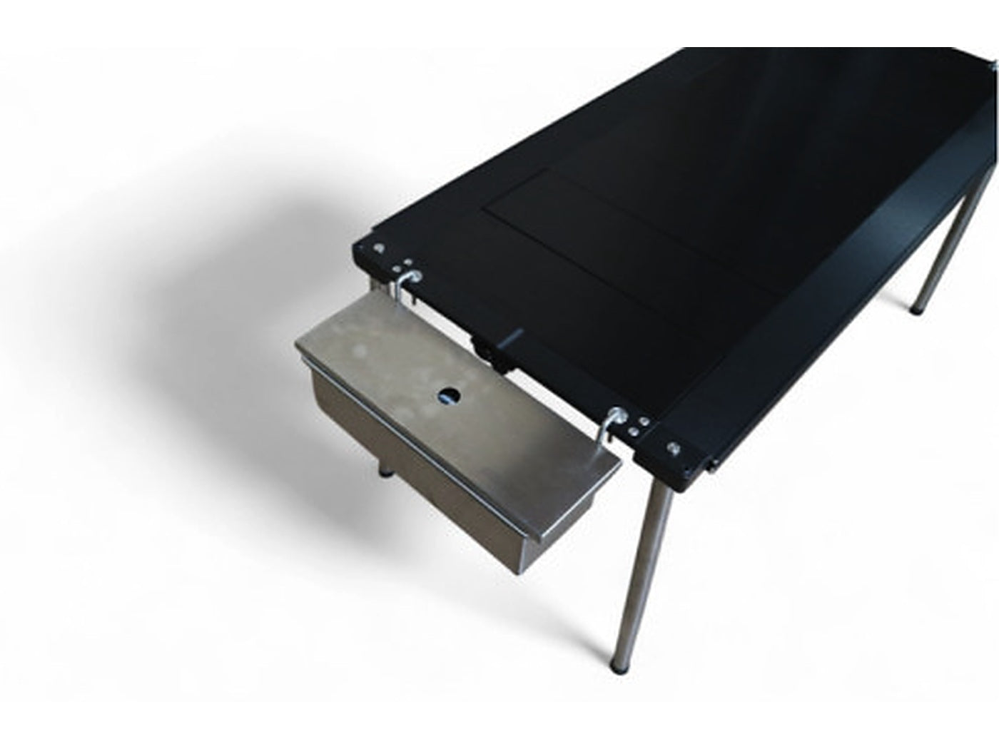 Side hanger hooked over a table rail carrying a stainless tray below the edge.