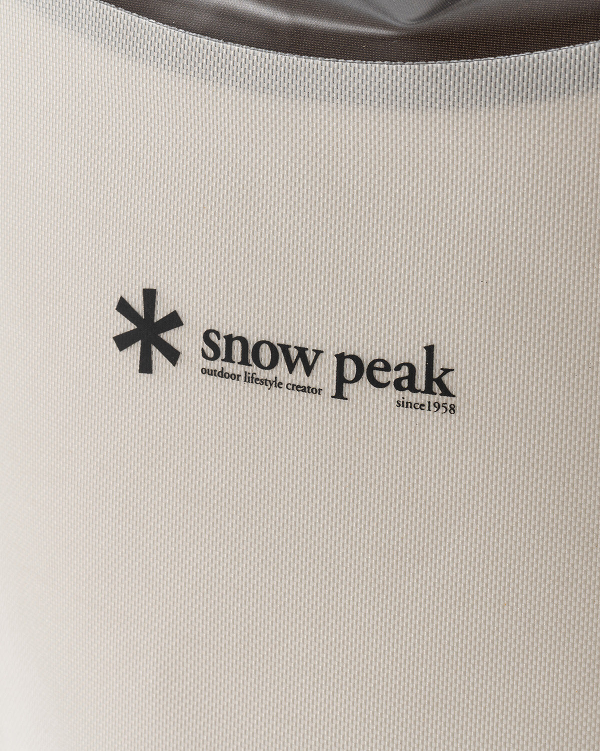 Soft Water Jug, close-up of the TPU-laminated fabric and logo