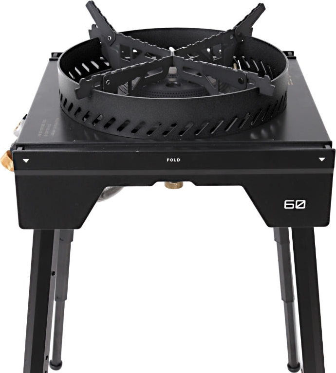 BUENOFE Stove Windscreen fitted to the BX-09 Table Burner raised on its four folding stand legs, shown against a white background so the full elevated cooking setup is visible.