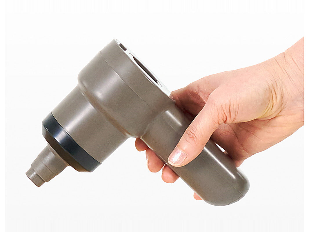 The Tornado 25 air pump held in one hand by its rounded handle, angled downward.