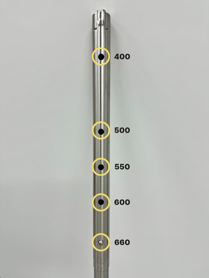 Sliding a telescoping leg to a marked height and locking the pin
