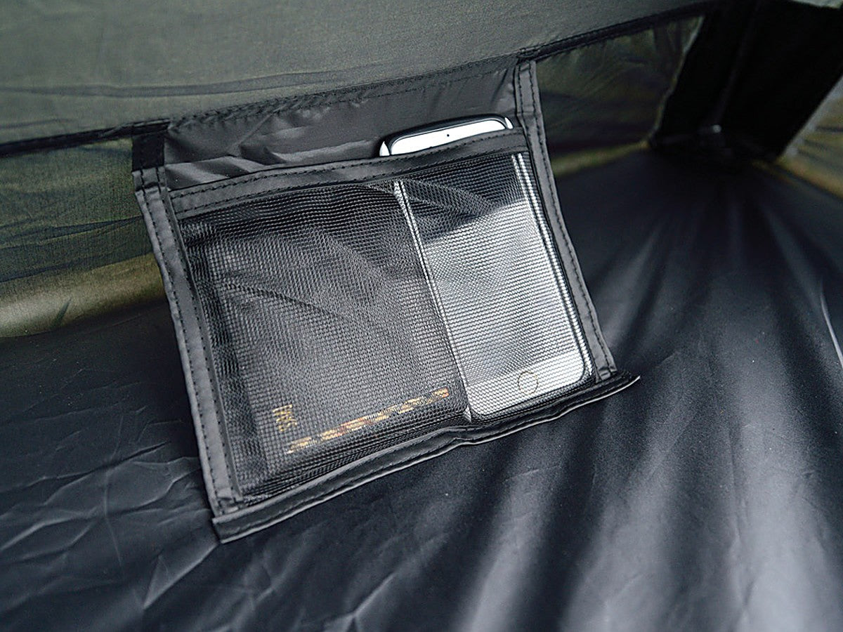 Interior mesh pocket holding a phone